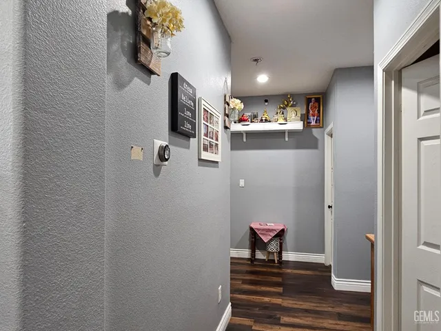 a view of a hallway with washer and dryer