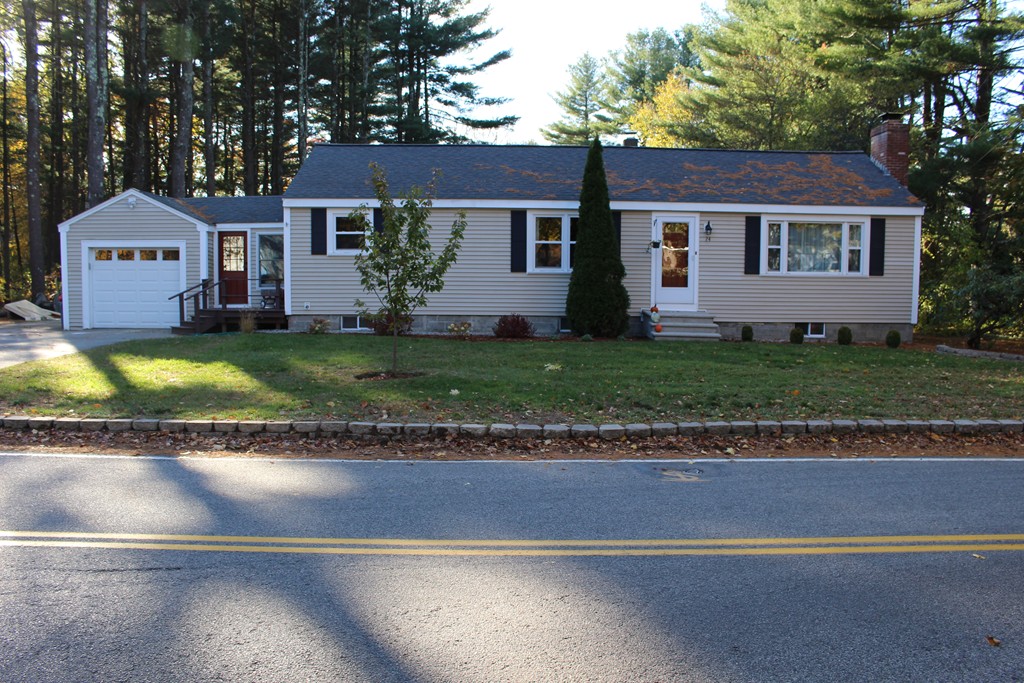 24 Garrison Road Chelmsford, MA 01824 - Photo 1 of 16 a view of a yard in front of a house