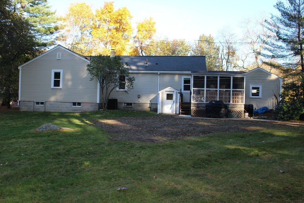 24 Garrison Road Chelmsford, MA 01824 - Photo 13 of 16 a view of a house with backyard and garden