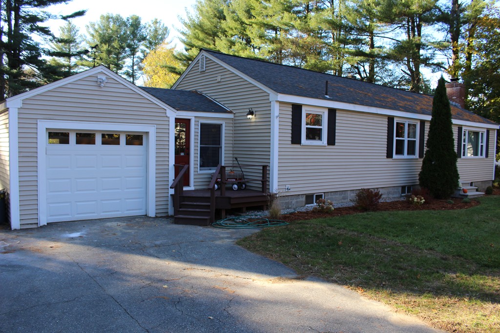 24 Garrison Road Chelmsford, MA 01824 - Photo 16 of 16 a view of a house with a yard
