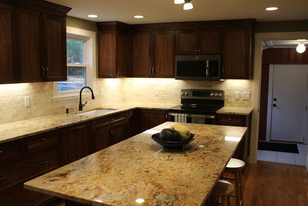 24 Garrison Road Chelmsford, MA 01824 - Photo 3 of 16 a kitchen with a sink a stove and refrigerator