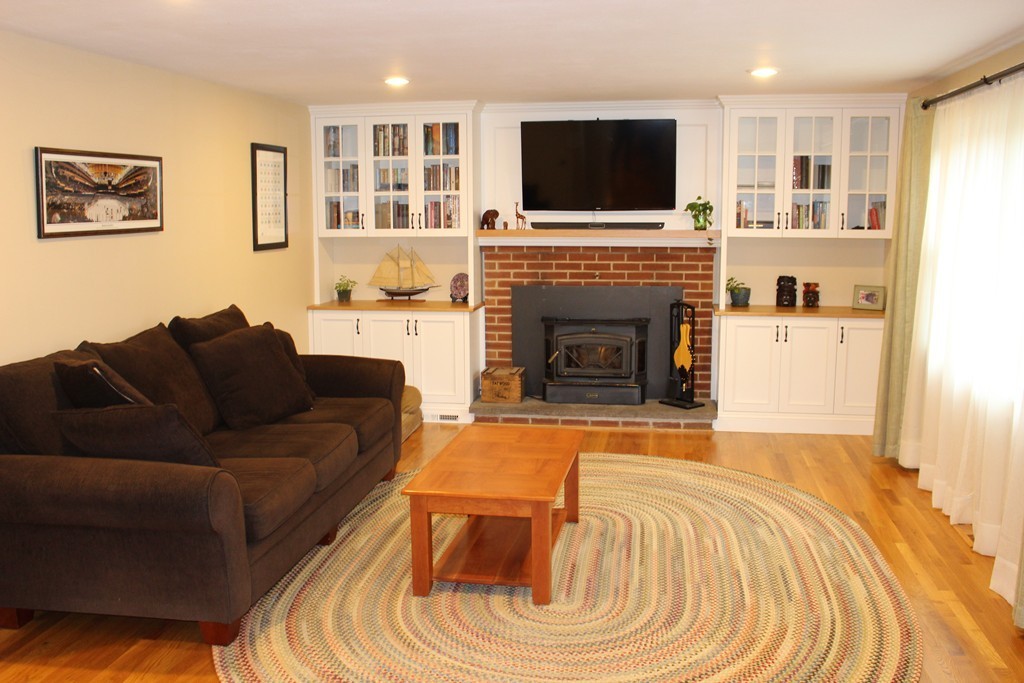 24 Garrison Road Chelmsford, MA 01824 - Photo 5 of 16 a living room with furniture and a fireplace