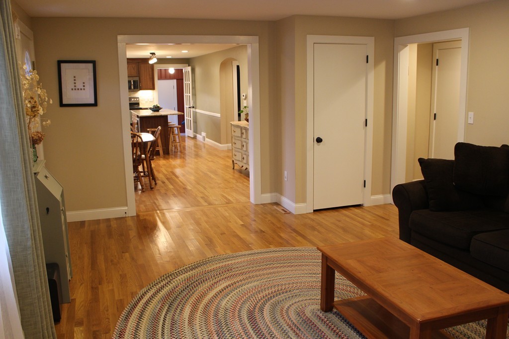 24 Garrison Road Chelmsford, MA 01824 - Photo 6 of 16 a view of a livingroom with furniture and wooden floor