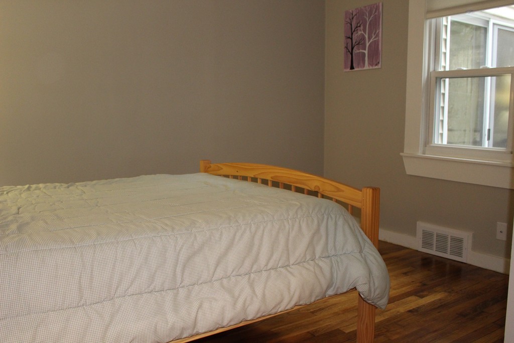 24 Garrison Road Chelmsford, MA 01824 - Photo 10 of 16 a bed sitting in a bedroom next to a window