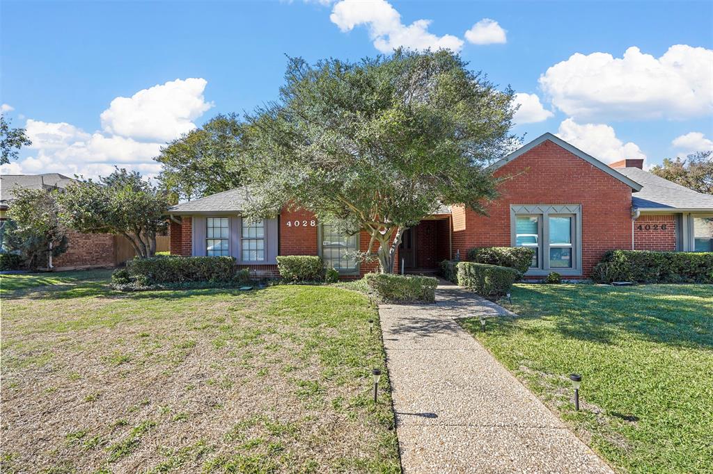 4028 St Christopher Lane Dallas, TX 75287 - Photo 1 of 1 a front view of a house with a yard
