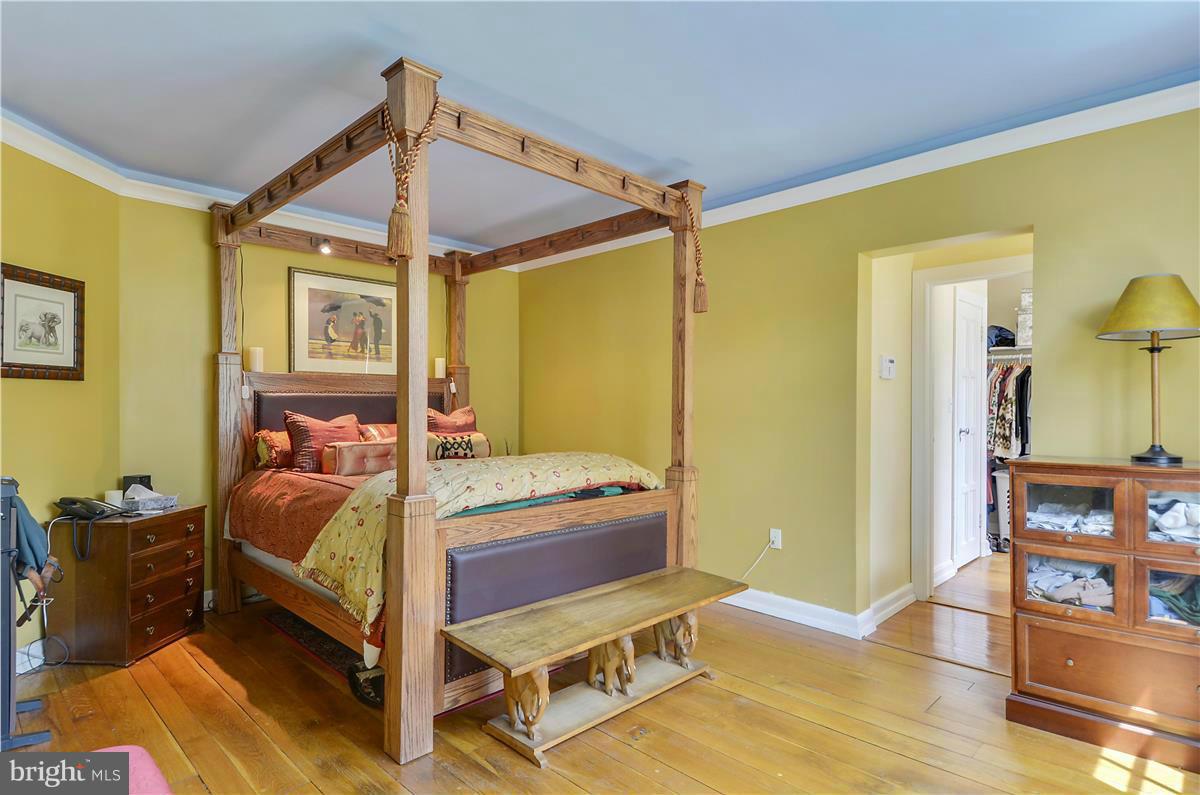 18505 Crossview Road Boyds, MD 20841 - Photo 12 of 30 a bedroom with a bed and wooden floor