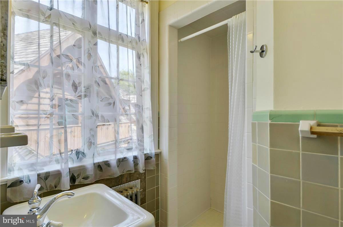 18505 Crossview Road Boyds, MD 20841 - Photo 14 of 30 a bathroom with a sink and a mirror