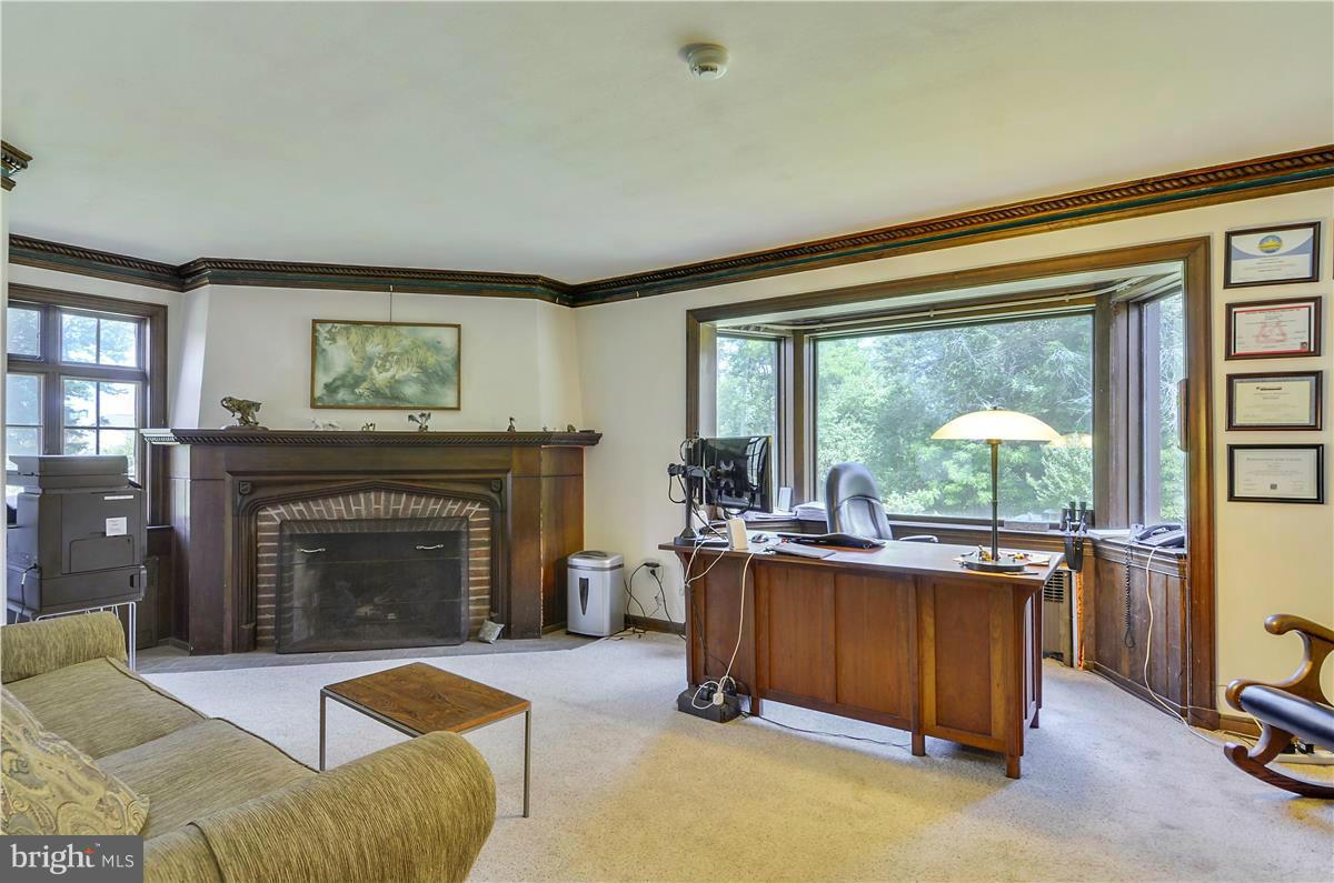 18505 Crossview Road Boyds, MD 20841 - Photo 23 of 30 a living room with furniture and a fireplace