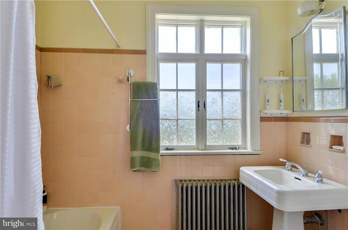 18505 Crossview Road Boyds, MD 20841 - Photo 10 of 30 a bathroom with a sink and a mirror