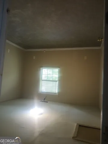 an empty room with wooden floor