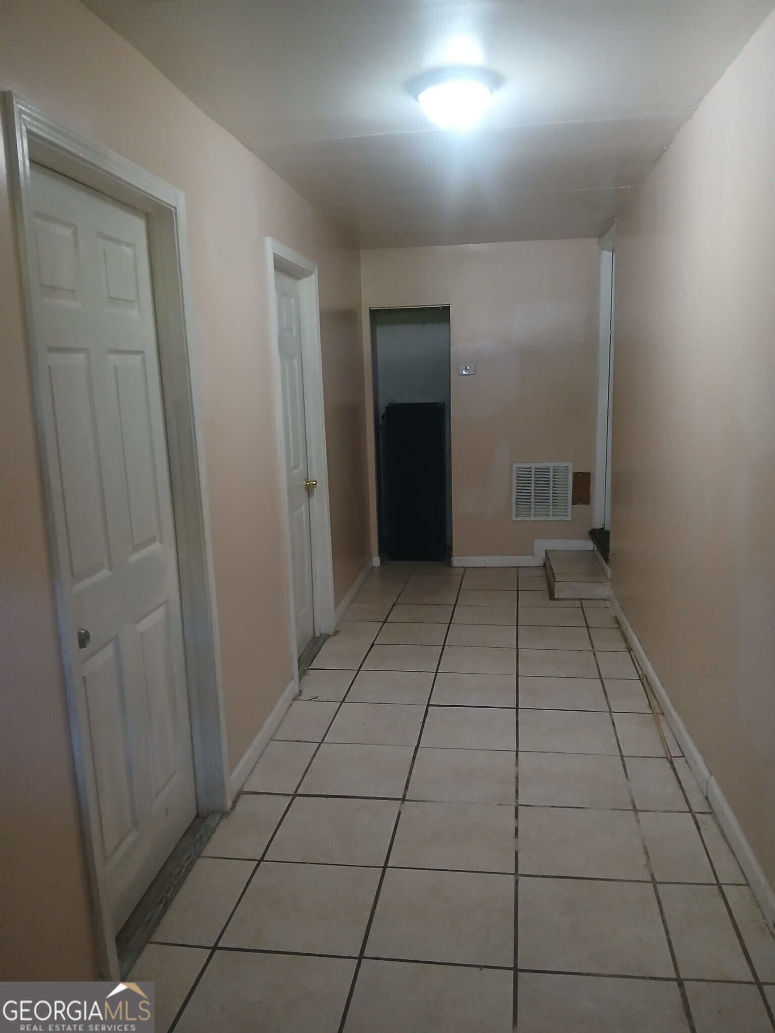 4526 Denise Drive Decatur, GA 30035 - Photo 16 of 18 an empty room with wooden floor