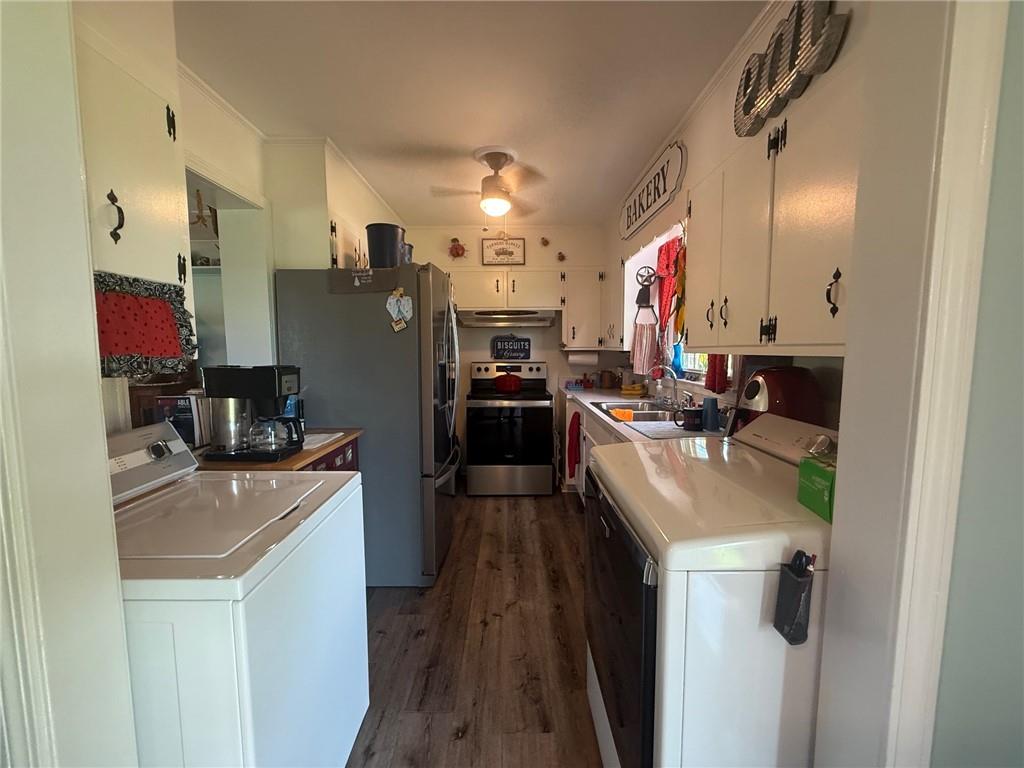 2705 Collard Valley Road Cedartown, GA 30125 - Photo 15 of 49 a kitchen with stainless steel appliances granite countertop a sink stove and refrigerator