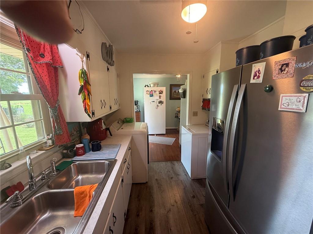 2705 Collard Valley Road Cedartown, GA 30125 - Photo 16 of 49 a kitchen with stainless steel appliances granite countertop a refrigerator and a sink