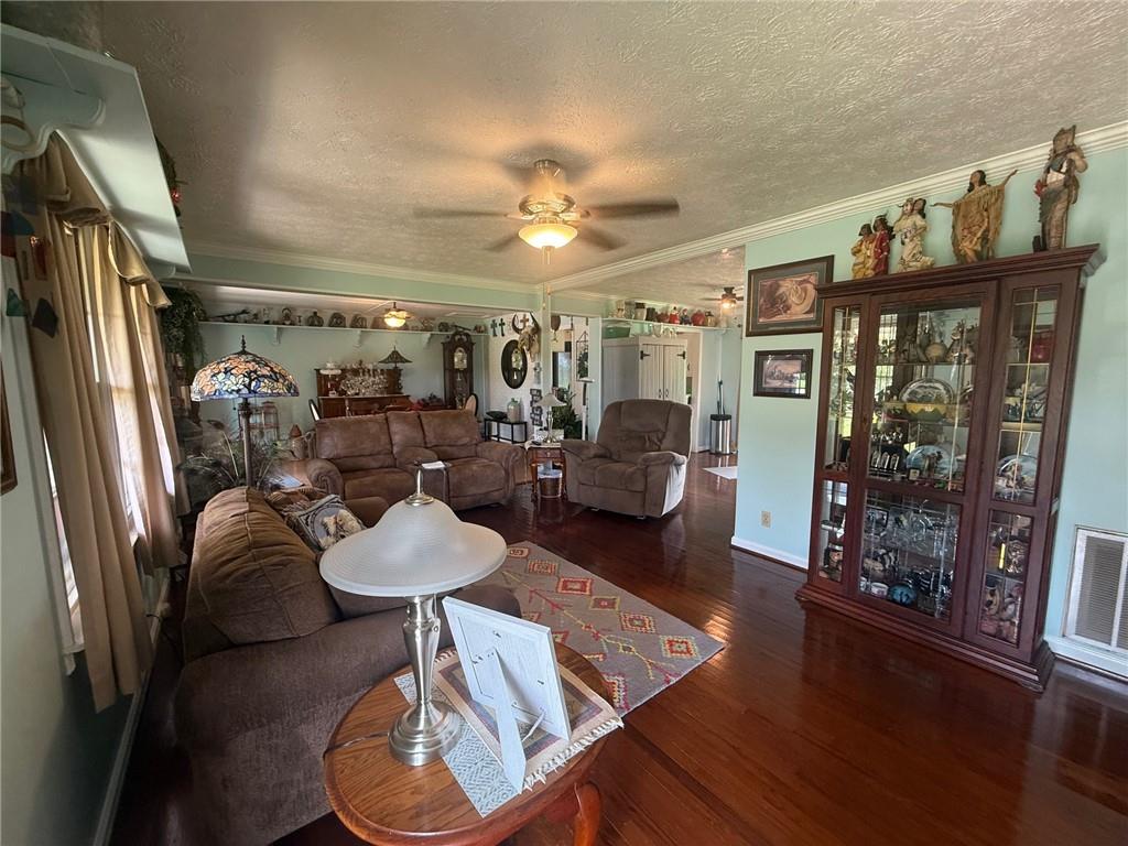 2705 Collard Valley Road Cedartown, GA 30125 - Photo 19 of 49 a living room with furniture and a chandelier