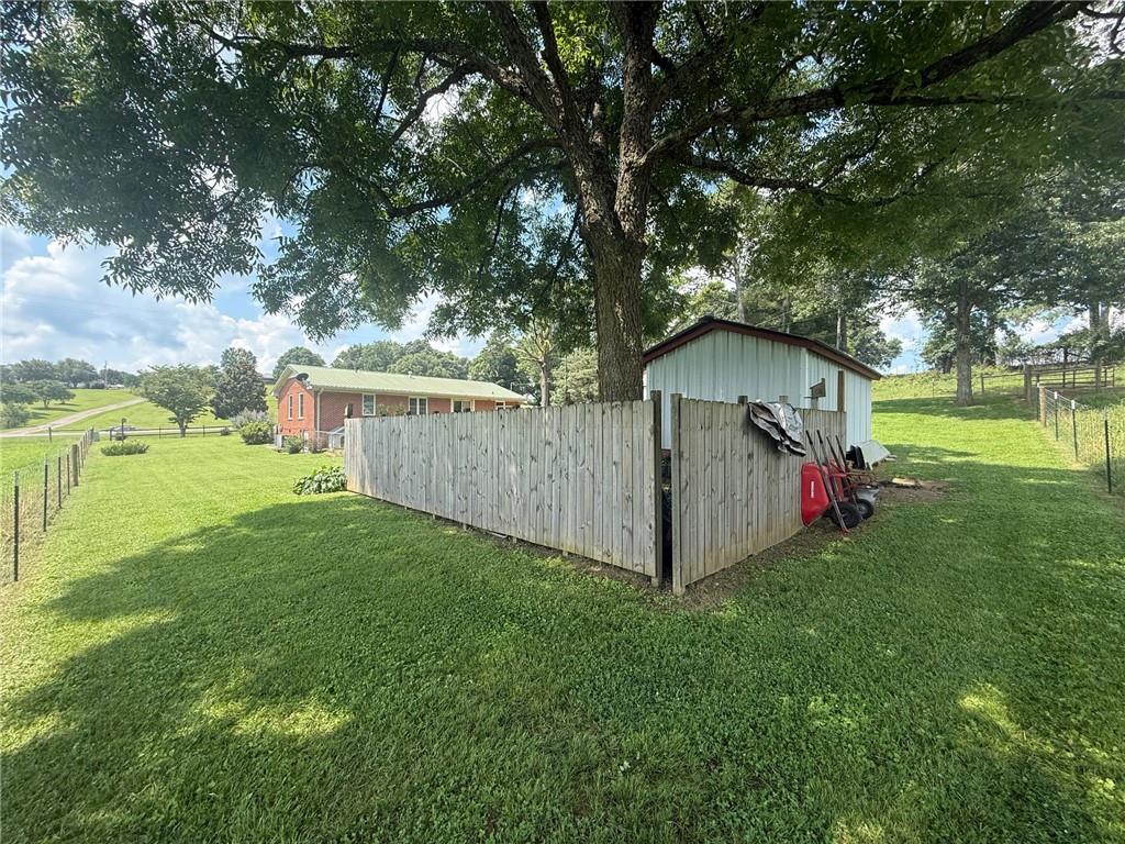 2705 Collard Valley Road Cedartown, GA 30125 - Photo 35 of 49 a view of backyard with small cabin