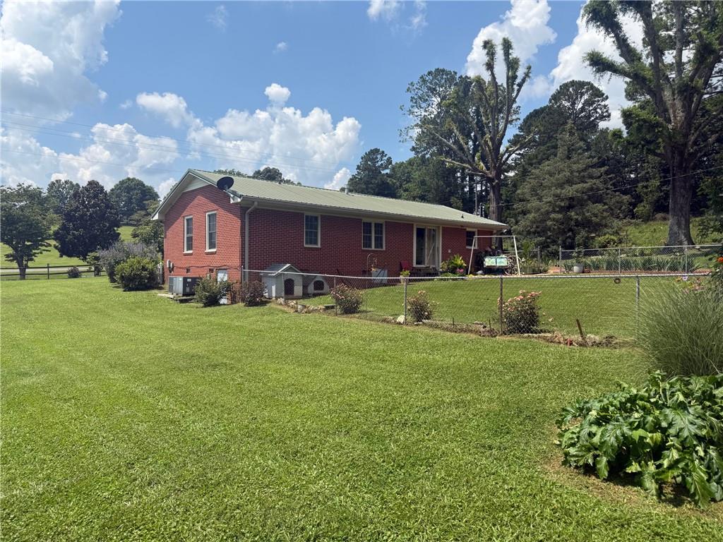 2705 Collard Valley Road Cedartown, GA 30125 - Photo 36 of 49 a view of a house with a yard