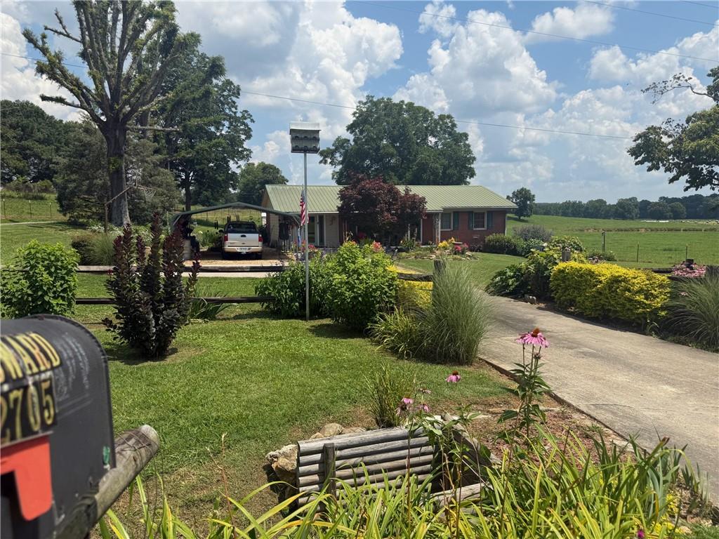 2705 Collard Valley Road Cedartown, GA 30125 - Photo 48 of 49 a view of backyard with seating area and green space
