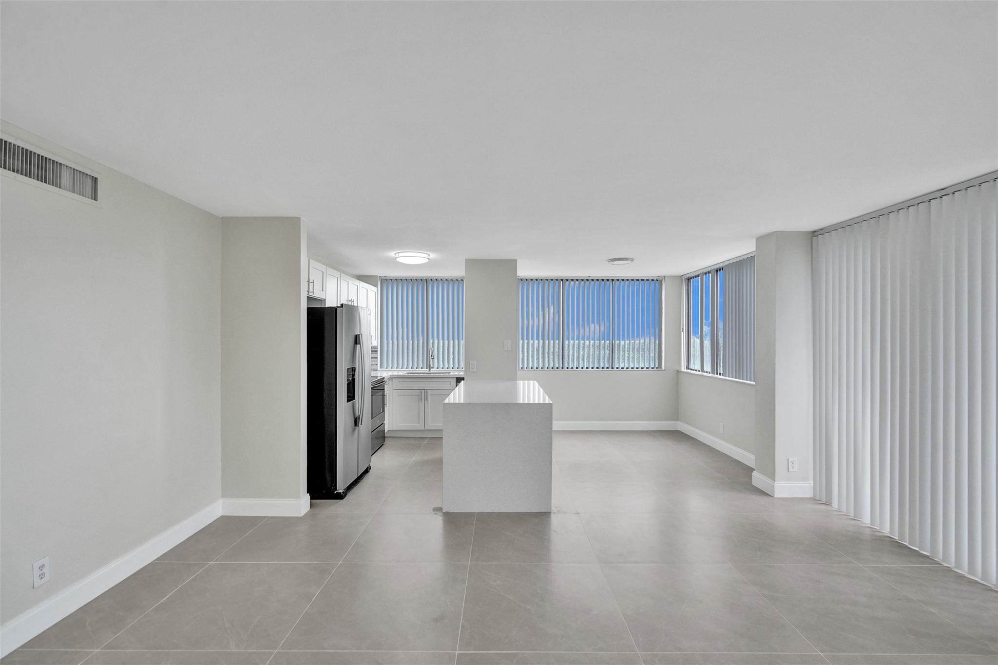 4222 Inverrary Boulevard, Unit 4810 Lauderhill, FL 33319 - Photo 4 of 63 a view of a kitchen with refrigerator and a sink
