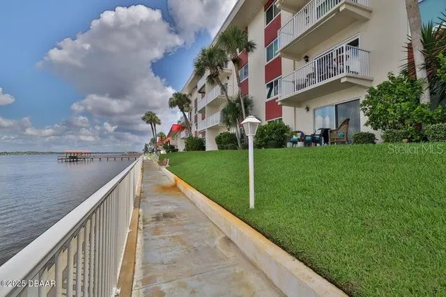a view of a swimming pool with chairs