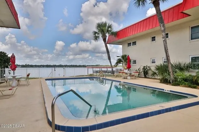 a view of a house with a swimming pool