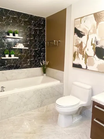 a bathroom with a sink a vanity and a mirror