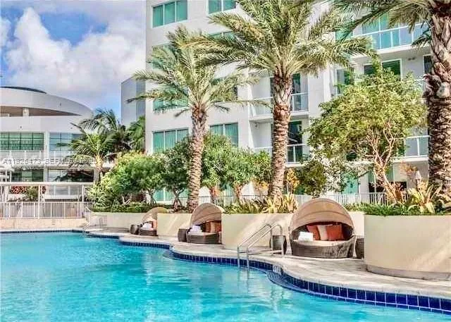 a view of a roof deck with couches and sky view