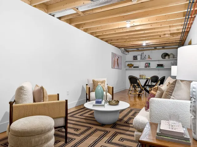a living room with furniture and a window