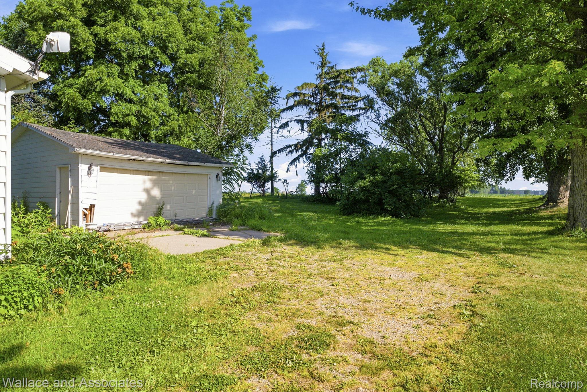 5949 Roach Road Croswell, MI 48422 - Photo 40 of 48 Detached garage with a single overhead door and side entry