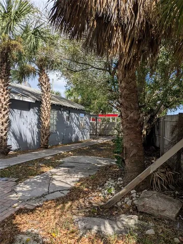 a view of street with wooden fence