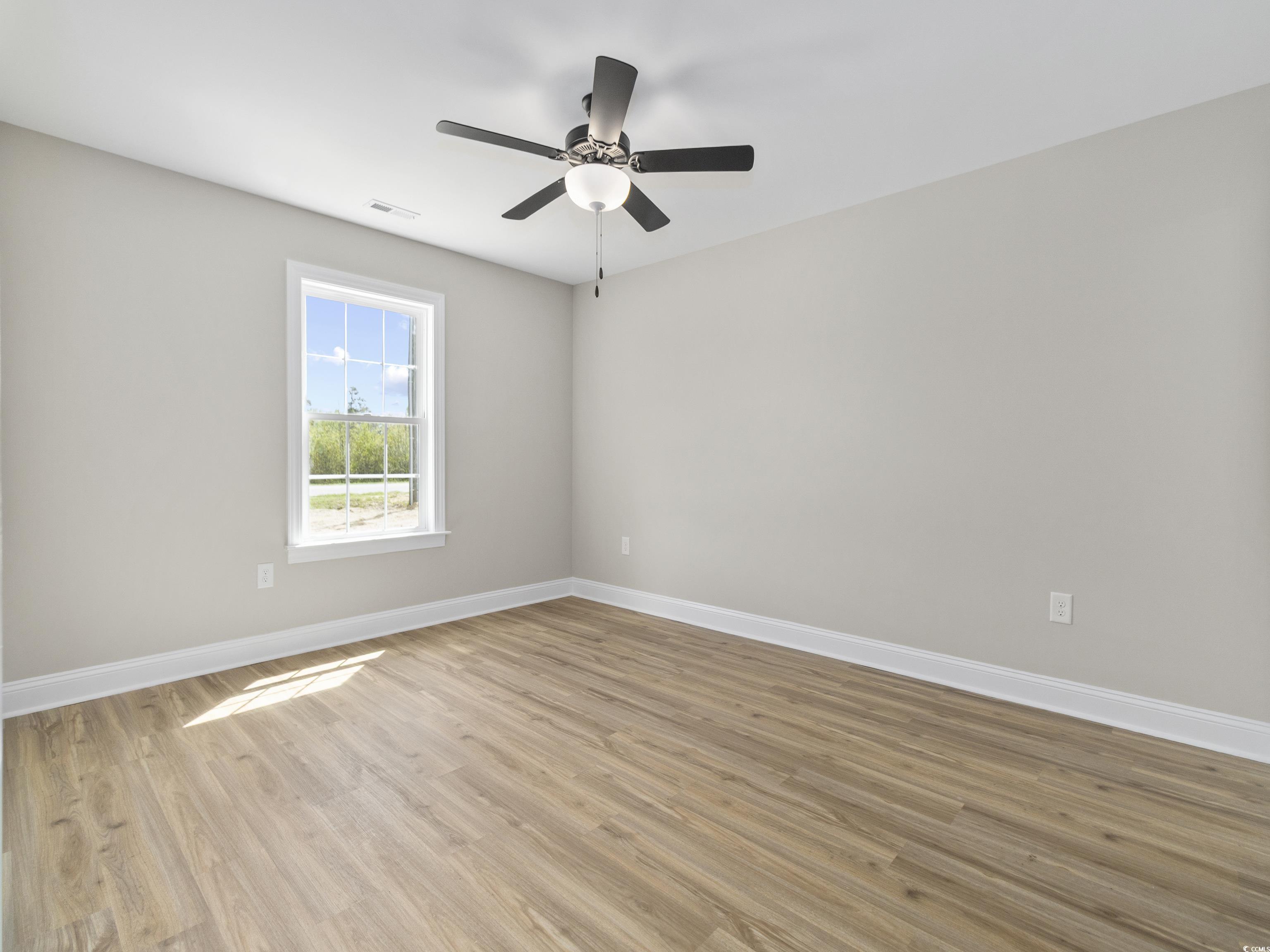 837 Highway 67 Loris Sc 29569 Loris, SC 29569 - Photo 20 of 31 Unfurnished room featuring visible vents, baseboards, a ceiling fan, and light wood-style floors