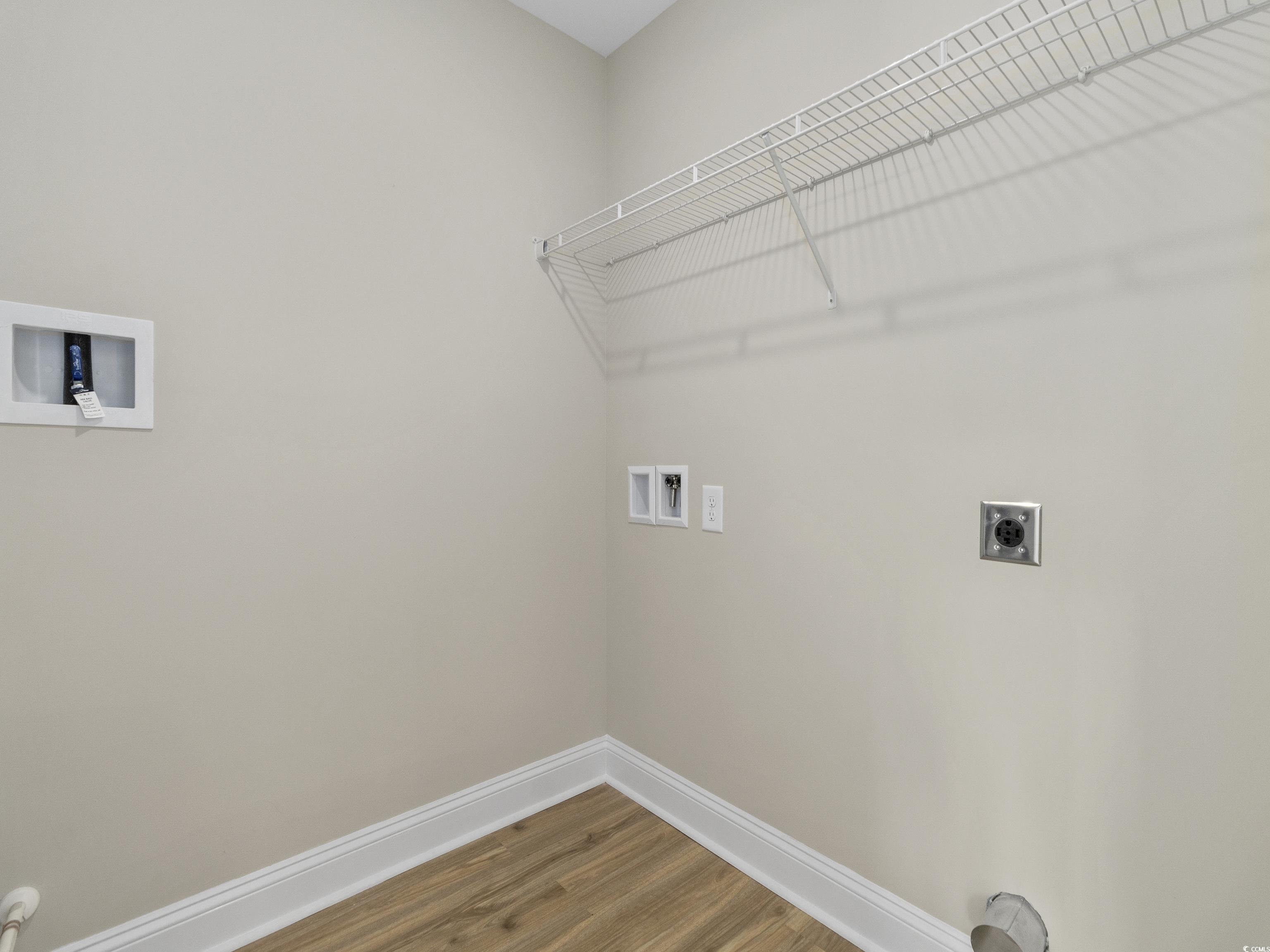 837 Highway 67 Loris Sc 29569 Loris, SC 29569 - Photo 25 of 31 Laundry room featuring laundry area, hookup for a washing machine, wood finished floors, hookup for an electric dryer, and baseboards