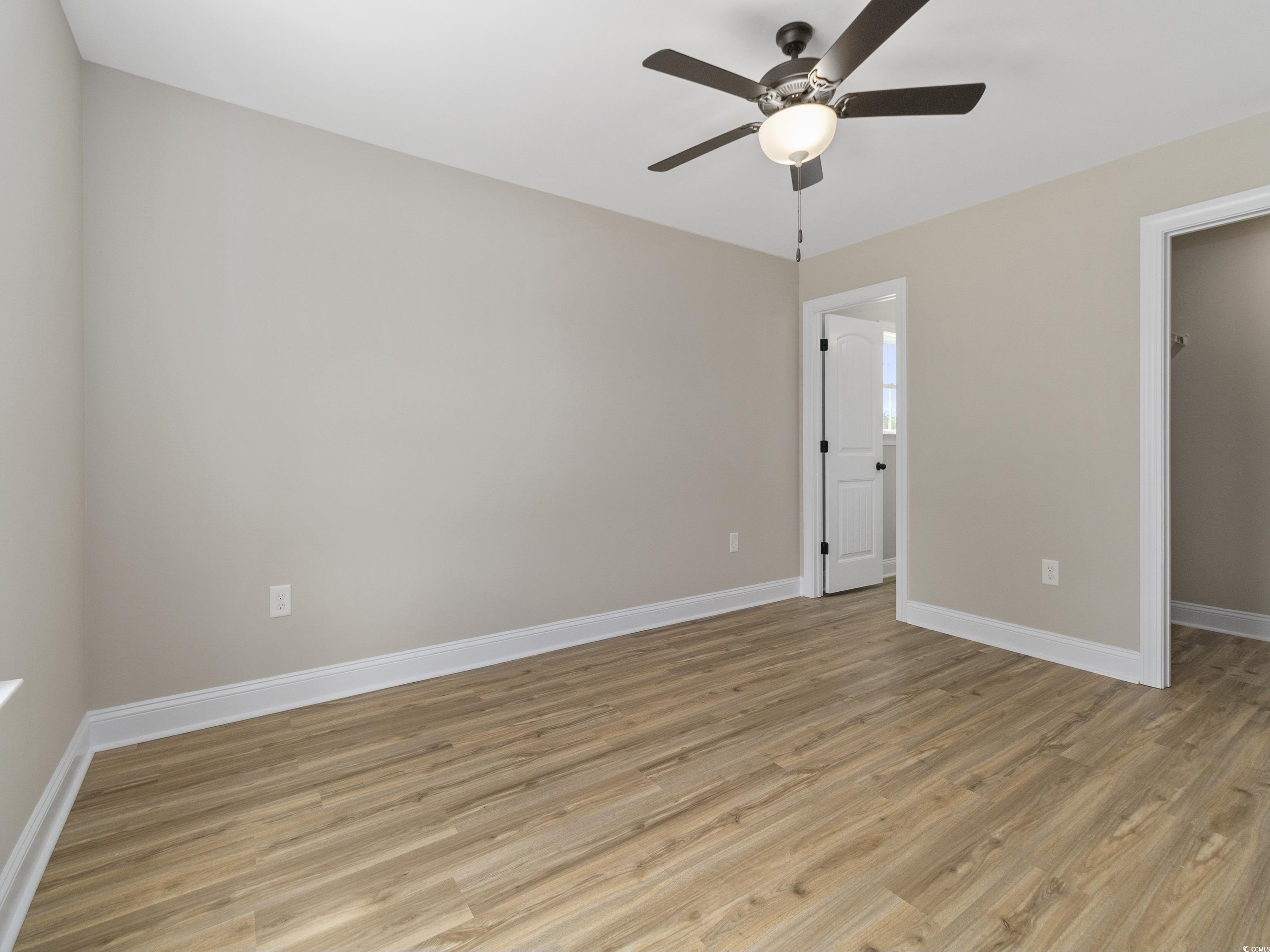 837 Highway 67 Loris Sc 29569 Loris, SC 29569 - Photo 26 of 31 Interior space with light wood-style flooring, baseboards, and a ceiling fan