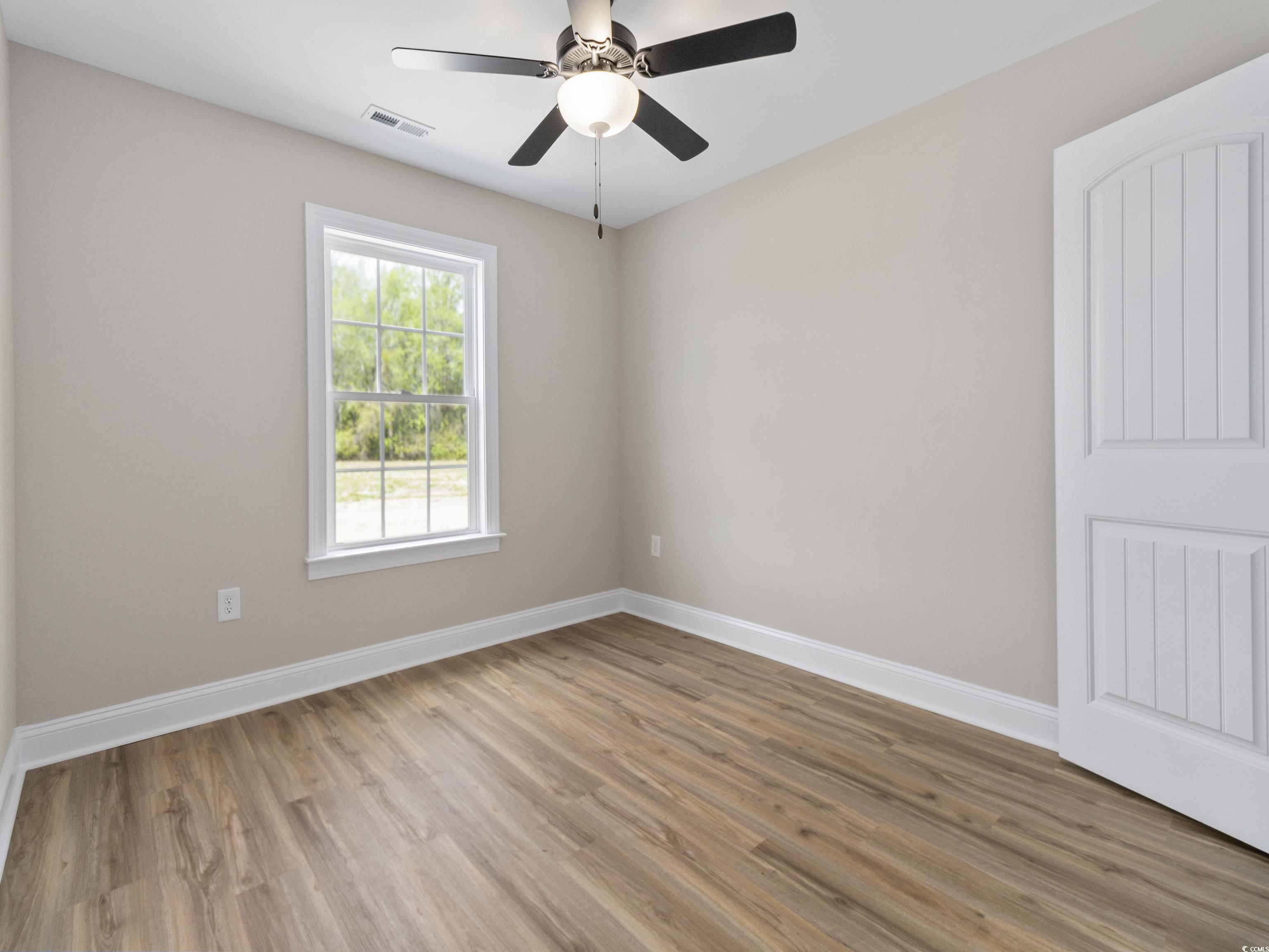 837 Highway 67 Loris Sc 29569 Loris, SC 29569 - Photo 29 of 31 Spare room featuring light wood-style flooring, baseboards, visible vents, and a ceiling fan