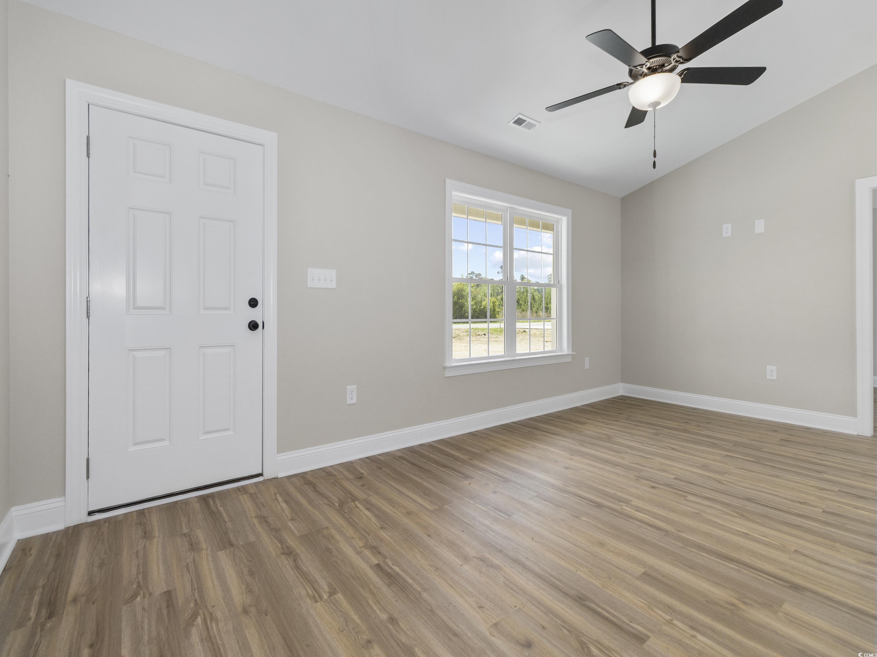837 Highway 67 Loris Sc 29569 Loris, SC 29569 - Photo 7 of 31 Interior space featuring baseboards, a ceiling fan, visible vents, lofted ceiling, and light wood finished floors