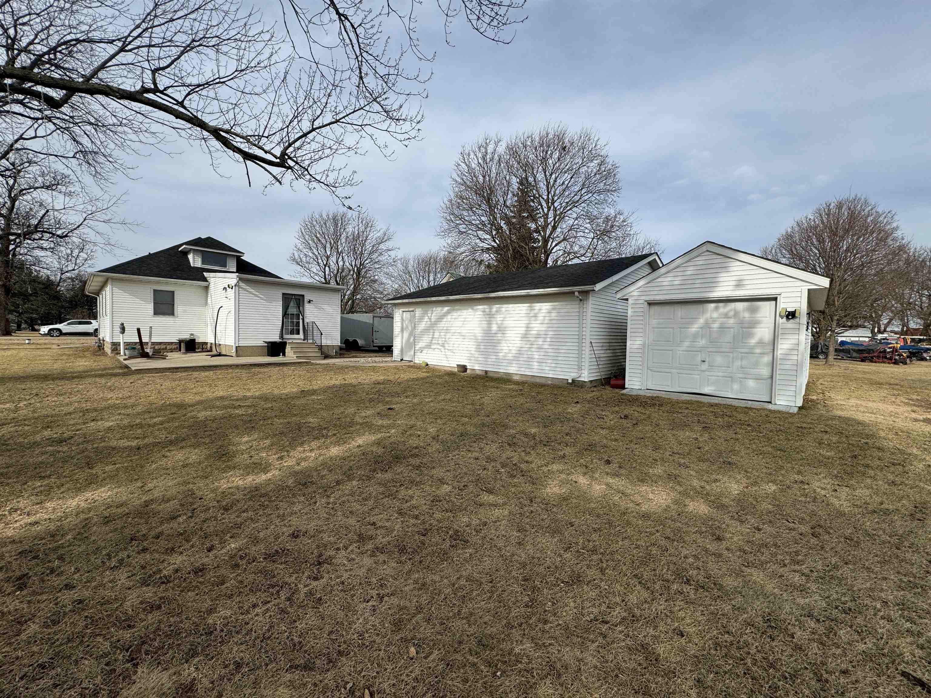 57 Herbert Road Kingston, IL 60145 - Photo 7 of 10 a front view of a house with a yard and garage