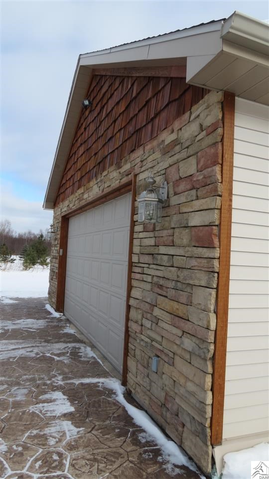 362 Ikola Road Esko, MN 55733 - Photo 14 of 20 Stone, stamped concrete and wood accents
