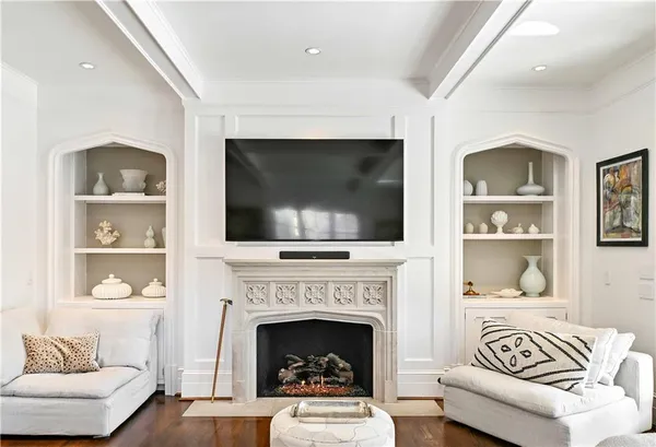 a spacious bathroom with a double vanity sink mirror and bathtub