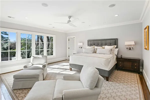 a kitchen with granite countertop a white cabinets and a stove