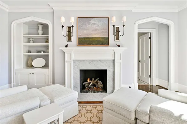 a bathroom with a granite countertop sink toilet a mirror a vanity and shower
