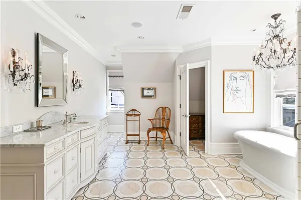 a bedroom with a bed a dresser and book shelf