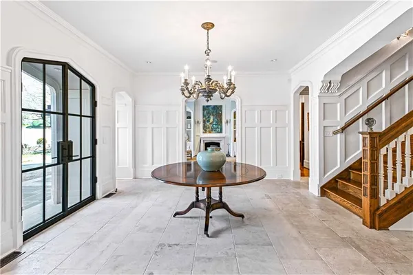 a view of a dining room with furniture window and outside view