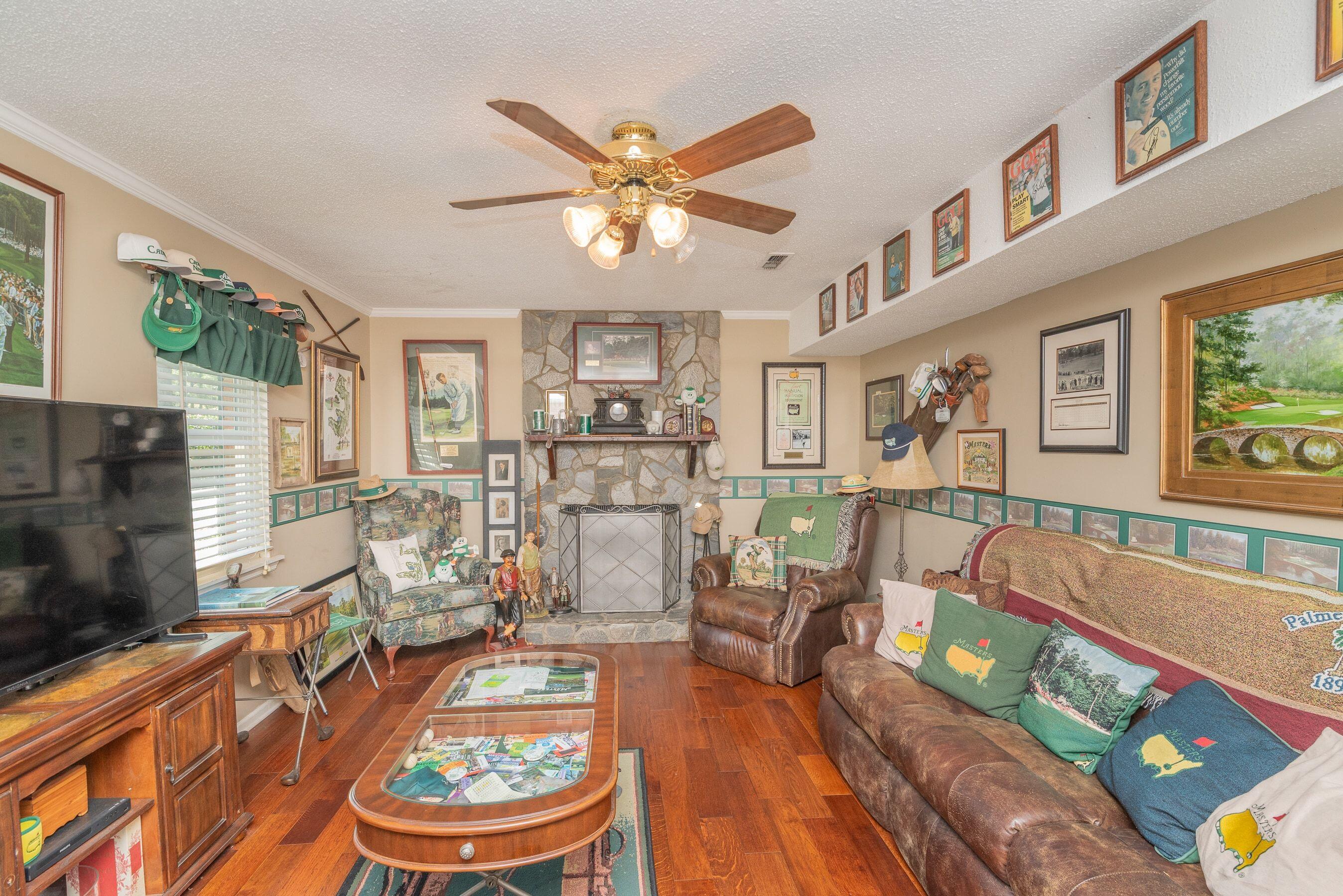 1117 Ridgemont Drive Aiken, SC 29803 - Photo 26 of 49 a living room with furniture and a fireplace