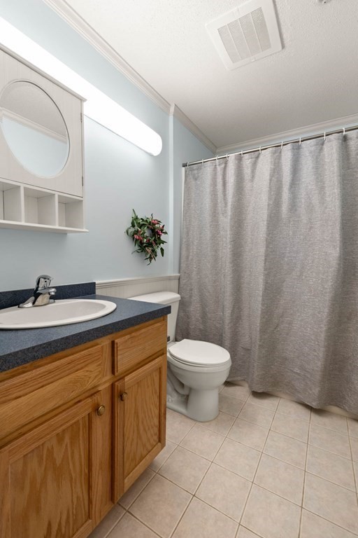 2 Ocean Avenue, Unit 3D Gloucester, MA 01930 - Photo 19 of 30 a bathroom with a toilet sink and mirror