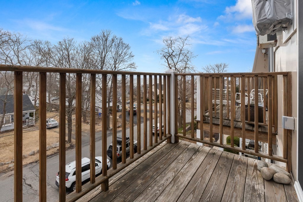 2 Ocean Avenue, Unit 3D Gloucester, MA 01930 - Photo 28 of 30 a view of a balcony with wooden floor and fence