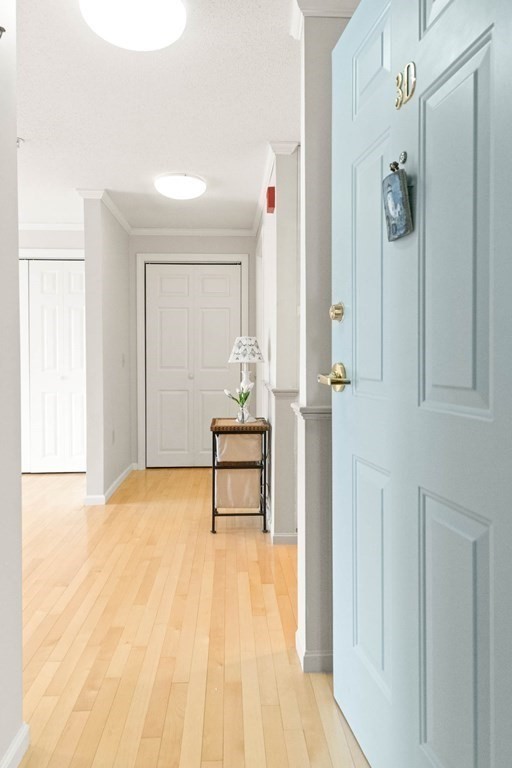 2 Ocean Avenue, Unit 3D Gloucester, MA 01930 - Photo 5 of 30 a view of a room with wooden floor and bench