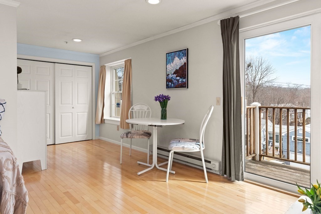 2 Ocean Avenue, Unit 3D Gloucester, MA 01930 - Photo 7 of 30 a workspace with wooden floor and a window