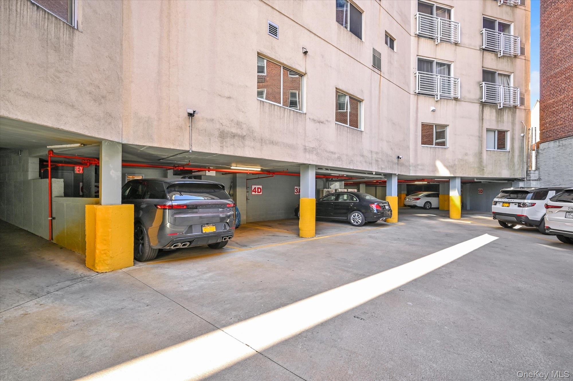 81-14 Queens Boulevard, Unit PH6C Queens, NY 11373 - Photo 17 of 19 View of vehicle parking with a parking deck