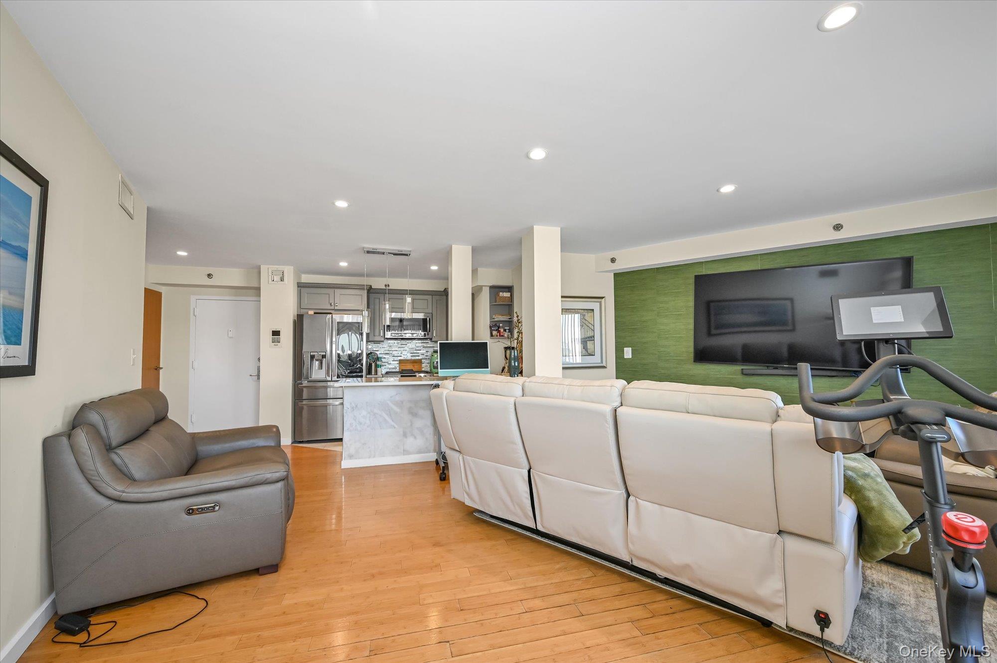 81-14 Queens Boulevard, Unit PH6C Queens, NY 11373 - Photo 5 of 19 Living area with recessed lighting and light wood-type flooring