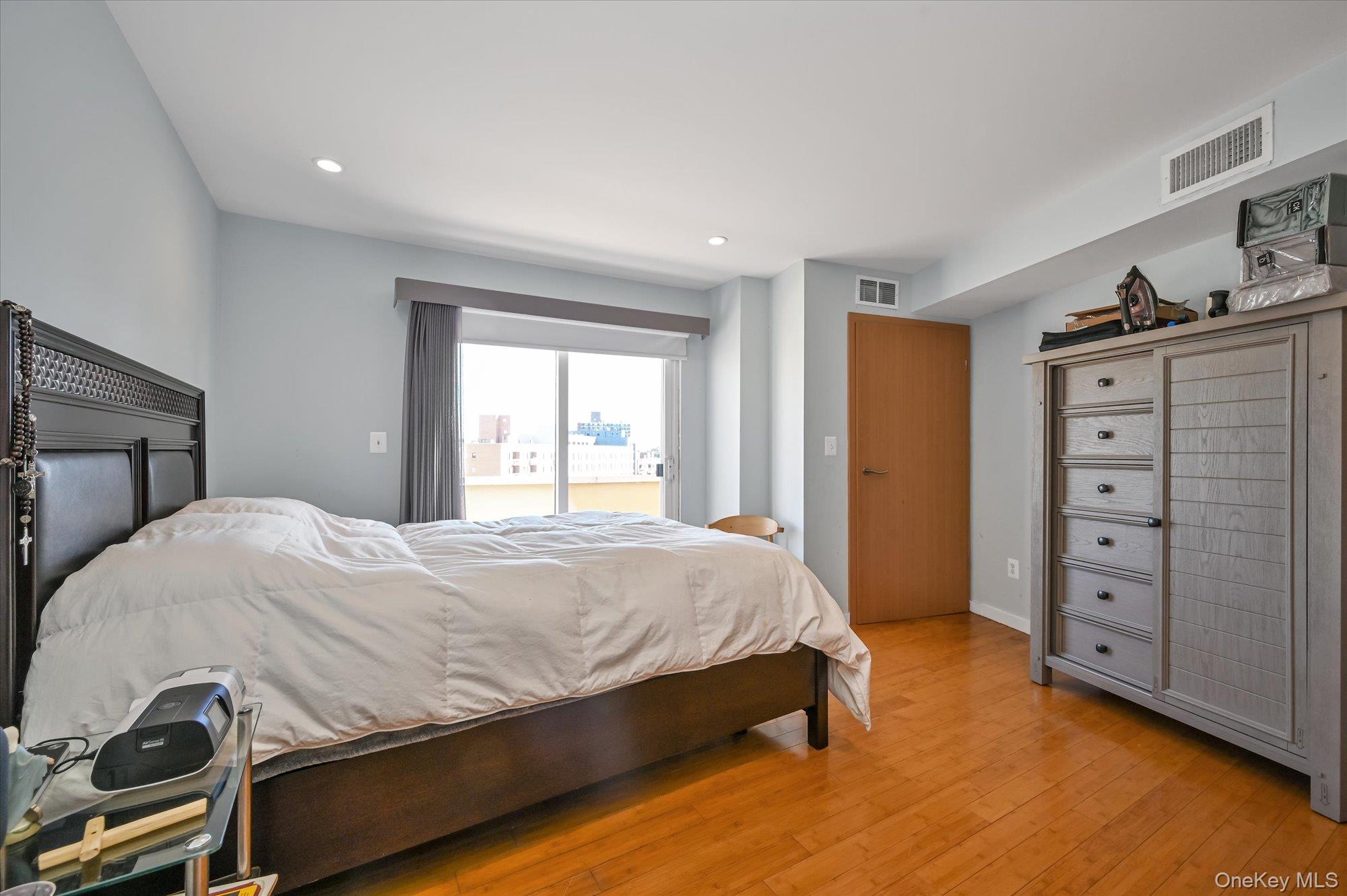 81-14 Queens Boulevard, Unit PH6C Queens, NY 11373 - Photo 9 of 19 Bedroom with hardwood / wood-style floors and recessed lighting