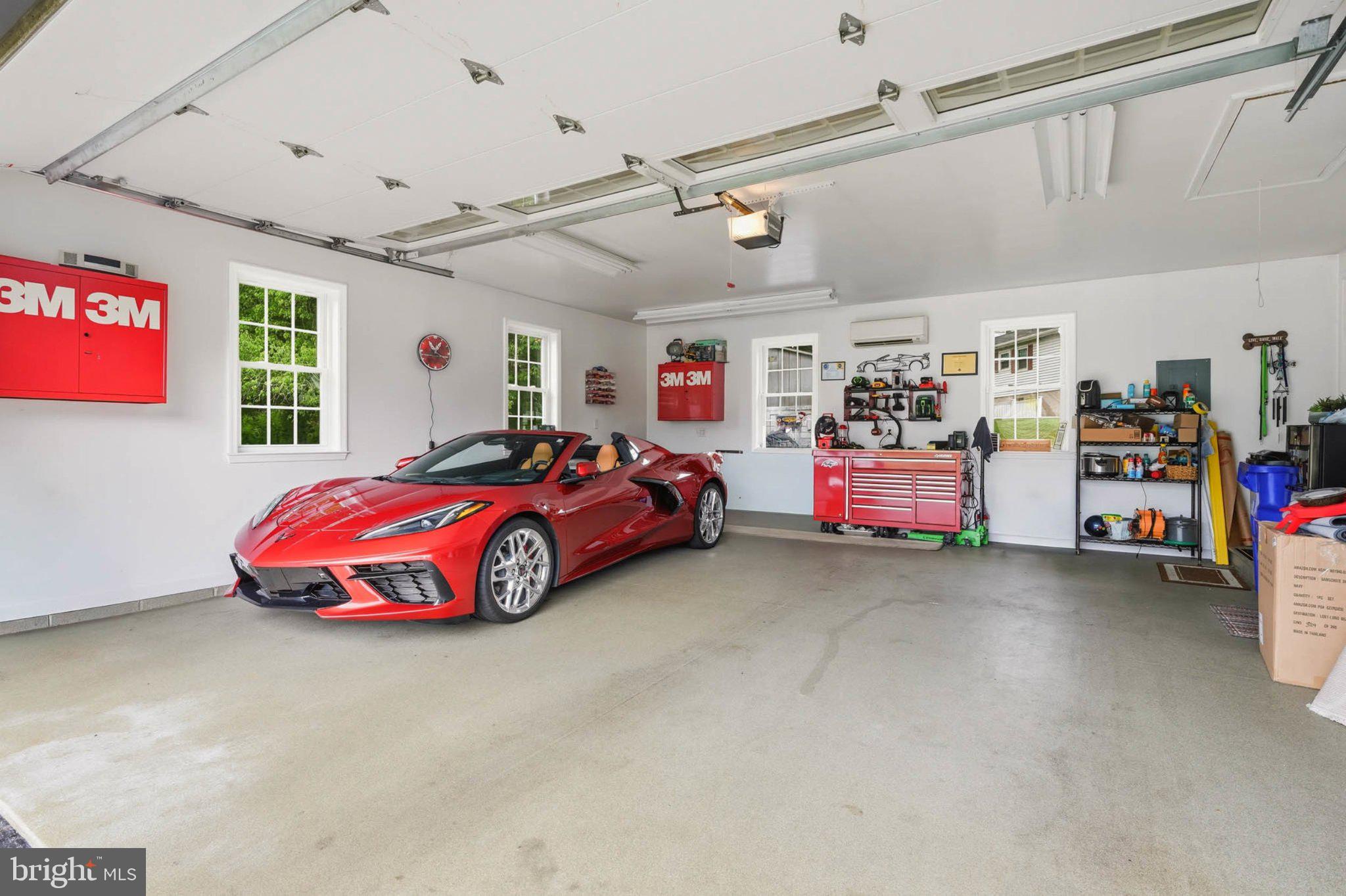 3202 North Chatham Road Ellicott City, MD 21042 - Photo 34 of 62 Sleek red sports car in a bright garage